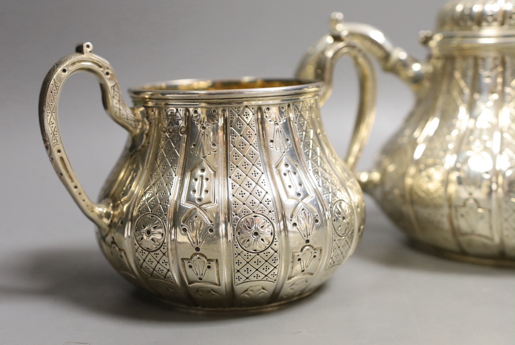 A Victorian engraved silver three piece tea set, of pear shape, by John Samuel Hunt (Hunt & Roskell late Storr & Mortimer), London, 1855/6, gross weight 45.4oz, together with original catalogue and purchase receipt, date